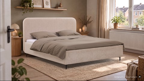 Een bed met hoofdeinde en kussens in een kamer