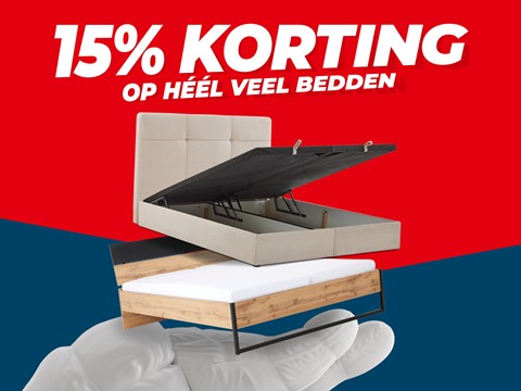 een hand die een bed vasthoudt