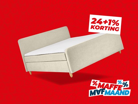 Een wit bed met een wit laken