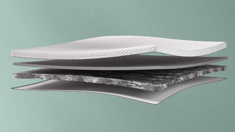 een witte matras met een laagje schuim