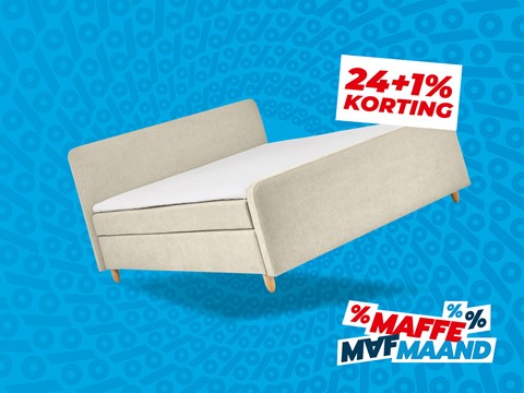 een wit bed met een bord